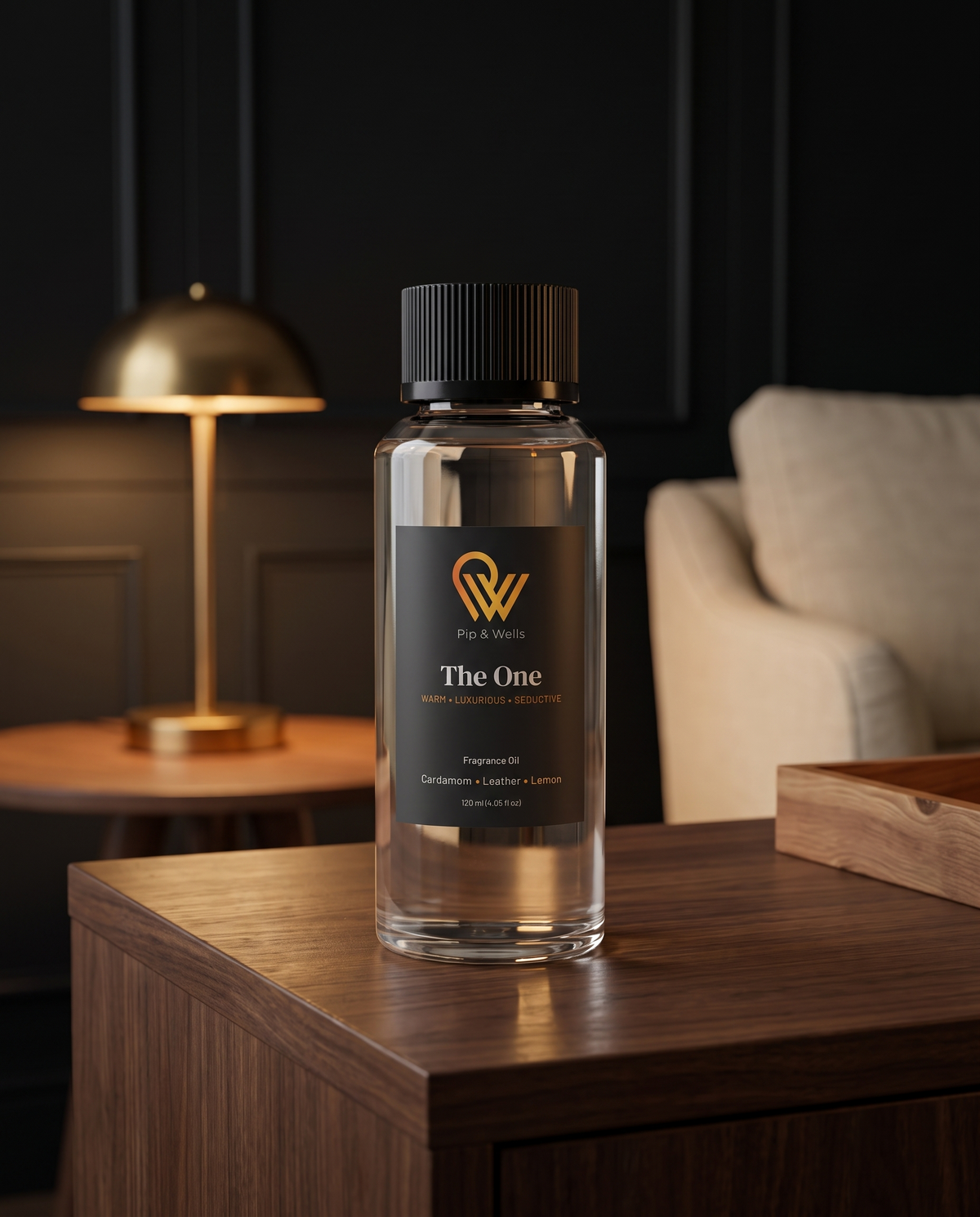 Pip & Wells The One fragrance oil 120 ml bottle from the Essence of Luxury set on a walnut console in a hotel-style lounge